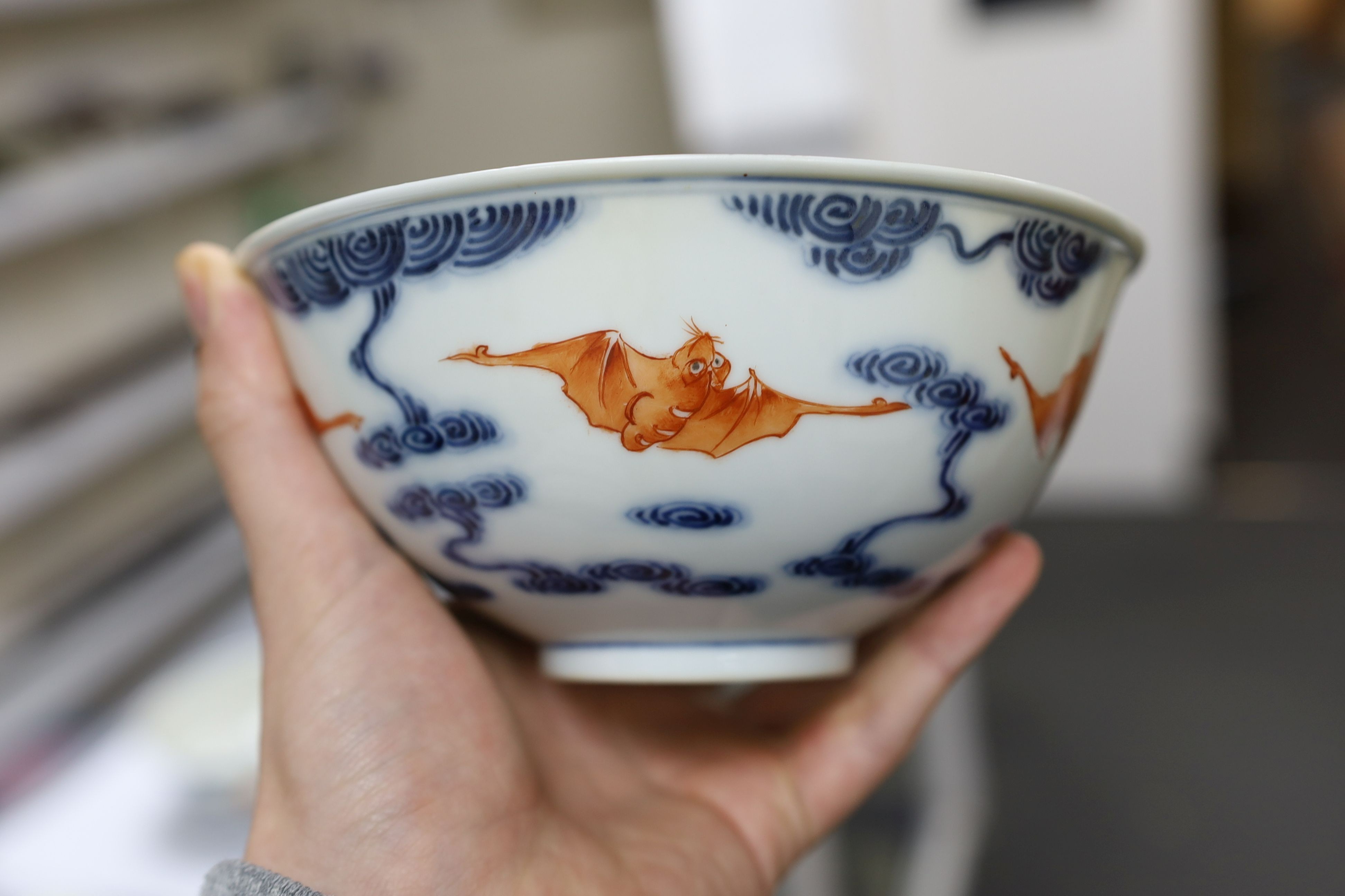 A pair of Chinese iron red and underglaze blue ‘five bat’ bowls, Guangxu mark and probably of the period (1875-1908), 16.5cm diameter